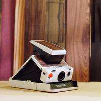 Polaroid Sx-70 Bianca con skin in legno