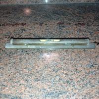 Antica livella in ottone 