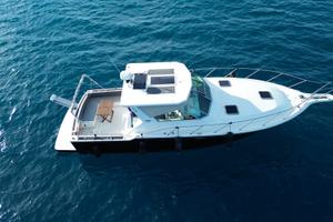 Tiara 3600 open 2 cab+1 wc 2x325 cat Permuta