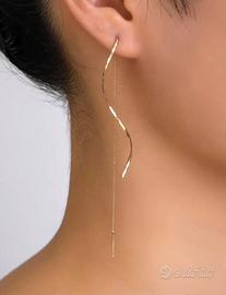 Orecchini lunghi ondolati e dorati