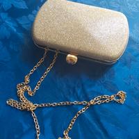 Pochette in metallo dorato