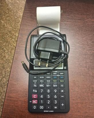Calcolatrice in buono stato + 8 rotoli