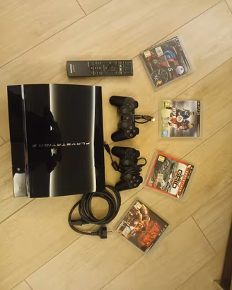 PS3 Fat + 2 controller + telecomando + 4 giochi