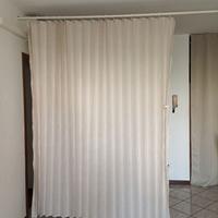 Tenda divisoria con bastone