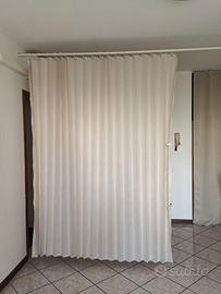 Tenda divisoria con bastone