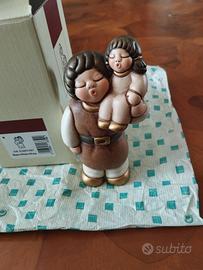 Personaggio Thun uomo con bambina