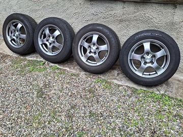 4 cerchi Dezent 15" Volkswagen Golf V con gomme