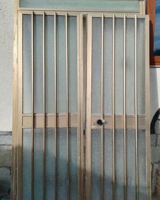 Porta alluminio vetro due battenti