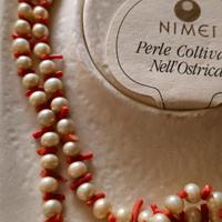 Nimei perle coltivate nell'ostrica e corallo