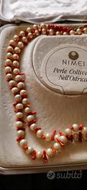 Nimei perle coltivate nell'ostrica e corallo
