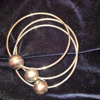 Tris di bracciali argentati con sfera 