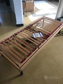 Letto con rete motorizzata e materasso