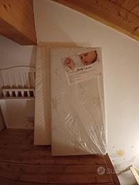 LETTINO CON SPONDA ABBASSABILE  E 2 MATERASSI