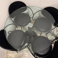 Tavolo tondo in marmo e cristallo