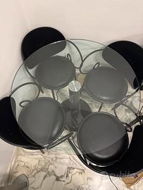 Tavolo tondo in marmo e cristallo