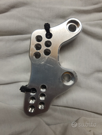 Arretratori pedane moto