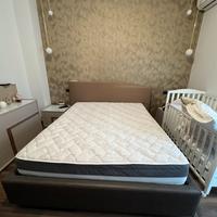 Letto contenitore matrimoniale con testiera