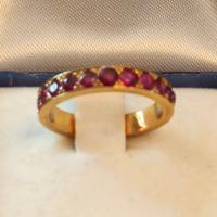 ANELLO RIVIERA IN ORO GIALLO DI RUBINI