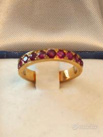 ANELLO RIVIERA IN ORO GIALLO DI RUBINI