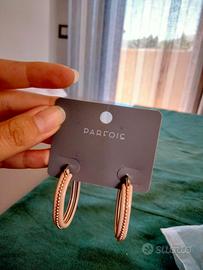 Orecchini Parfois ovali color ecrù decori argentat