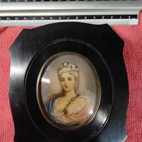 Cornice con miniatura.