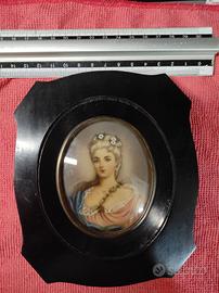 Cornice con miniatura.