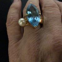Anello oro 18 topazio azzurro eperla