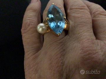Anello oro 18 topazio azzurro eperla