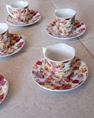 set piattini e tazzine in porcellana con decoro