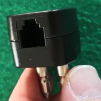 Adattatore per presa telefonica.