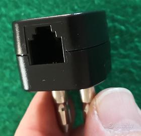 Adattatore per presa telefonica.