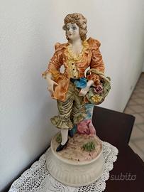 Statuetta porcellana cavaliere con fiori 40 cm