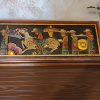 Tavola in legno scolpita e decorata