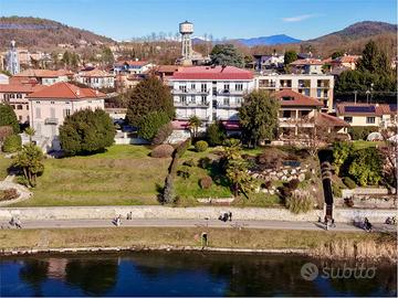 Trilocale vista fiume con posto auto a pochi pass