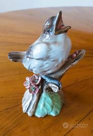 Statuina vintage uccellino su ramo