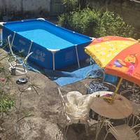 piscina con motore telo copertura e il telo sotto