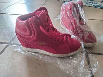 Scarpe della Puma Rosa
