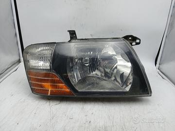 Faro ant dx MITSUBISHI PAJERO II '03
