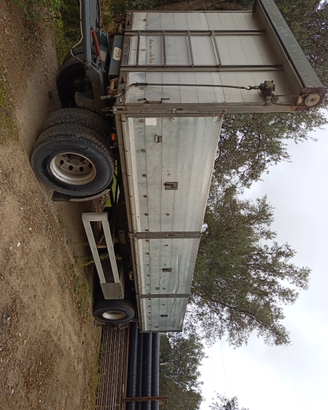 Rimorchio ribaltabile bilaterale