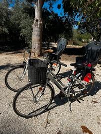 Biciclette con seggiolini