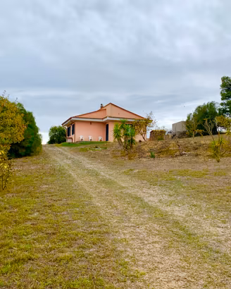 Terreno con casa.