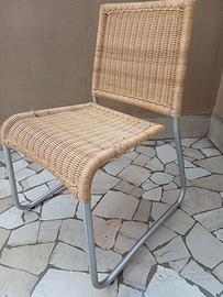 Sedie midollino e tavolo cristallo design