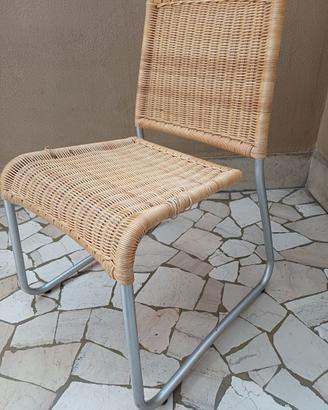 Sedie midollino e tavolo cristallo design