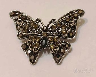 Spilla vintage a forma di farfalla brunita strass