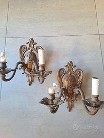 Coppia di appliques in metallo a due luci 