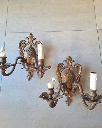 Coppia di appliques in metallo a due luci 
