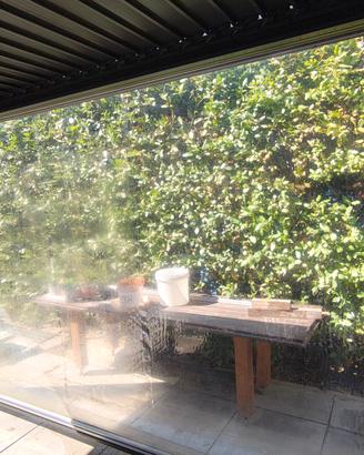 Tenda a rullo per esterno in PVC trasparente