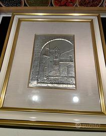Cornice con scultura in argento