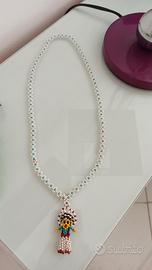 Collana vintage pupino etnico con perline.