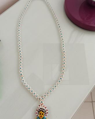 Collana vintage pupino etnico con perline.